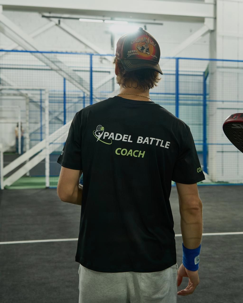 Padel Battle coach on the indoor court
